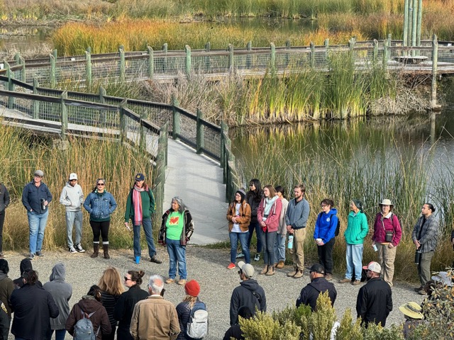 Diana Almendariz leading the opening circle in front of the Conservancy's wetlands at Leok Po 2023