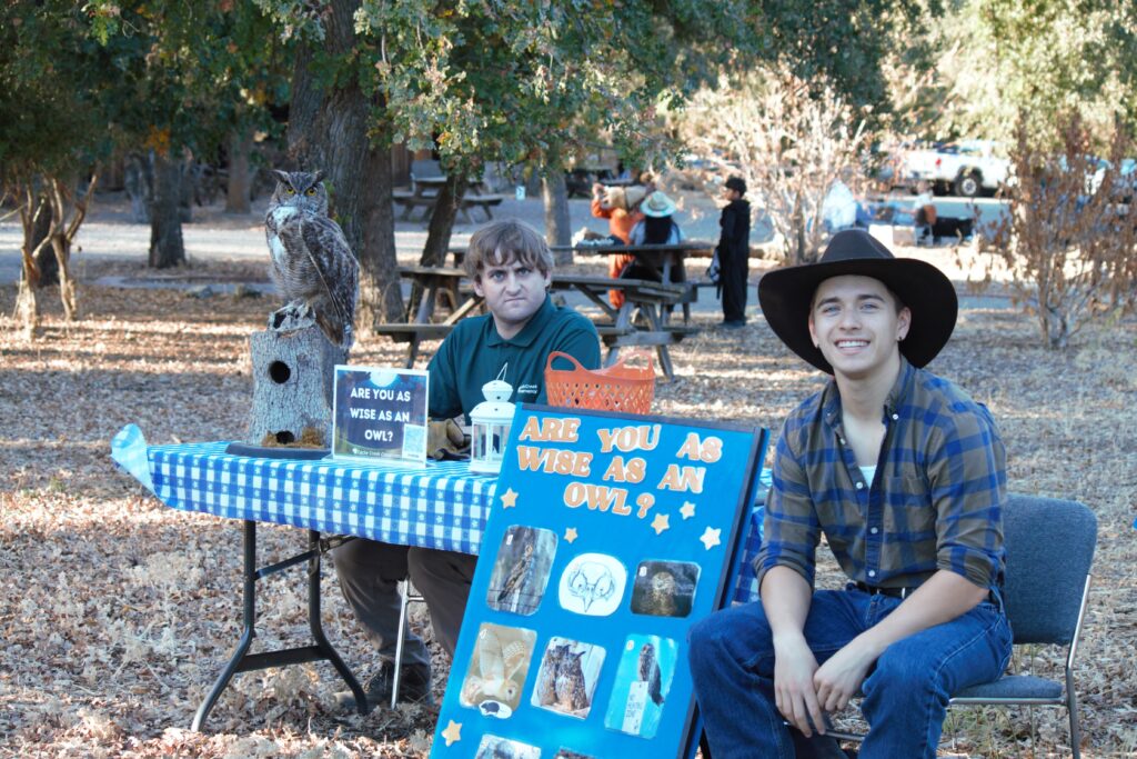 Image of Cache Creek Conservancy Staff and Intern hosting a booth at Tree Trunk or Treat